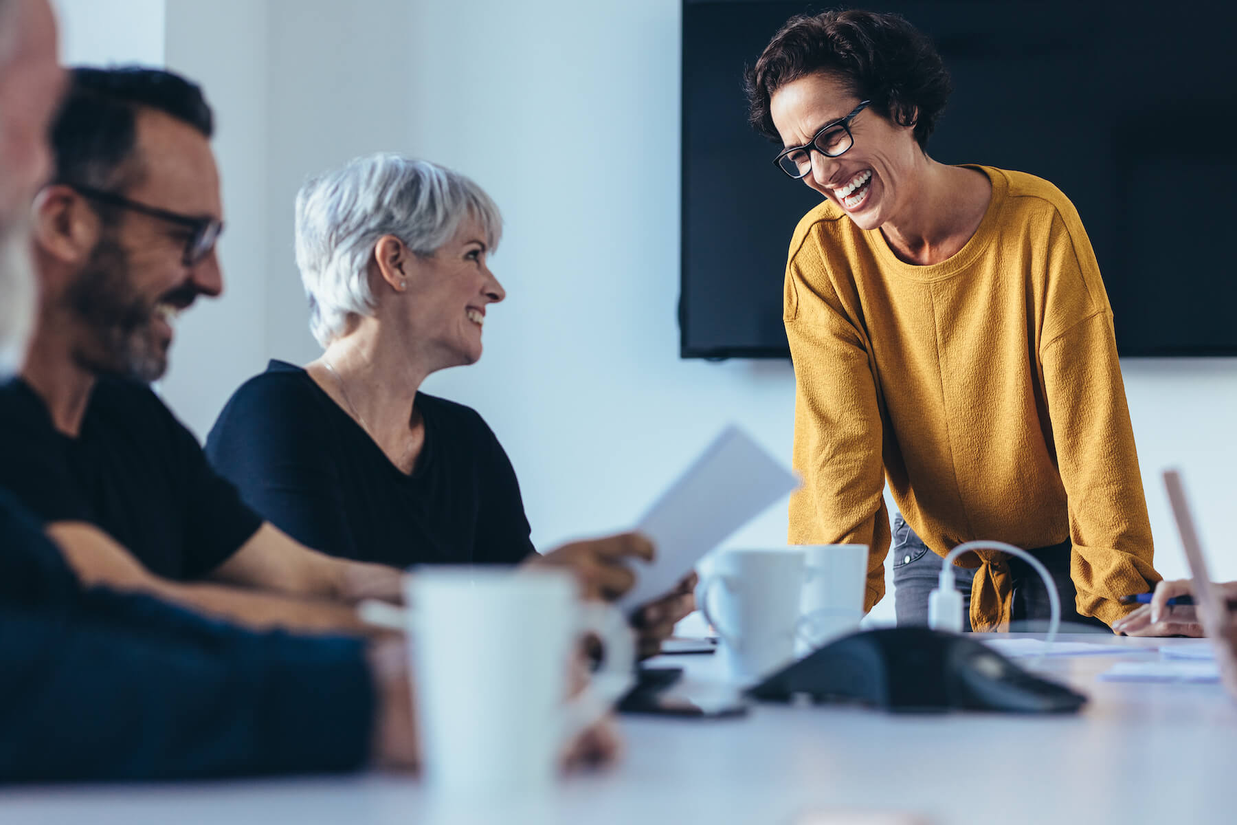 A dynamic team of professionals engaging in a strategy session, highlighting the dedication to client-focused outcomes in the finance sector.