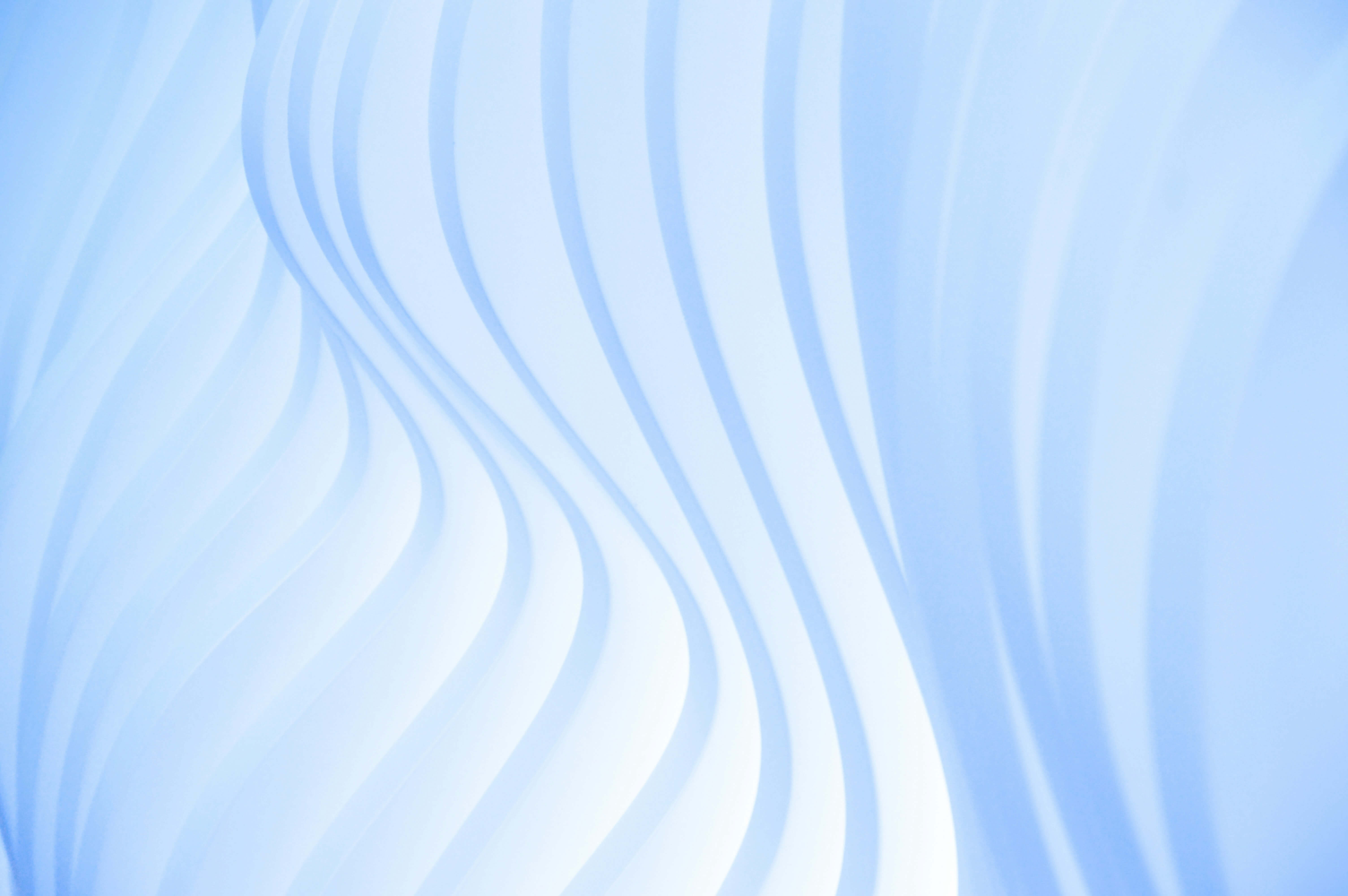 Abstract image with soft blue waves, representing the fluid and adaptive financial strategies offered by Caldera Capital.